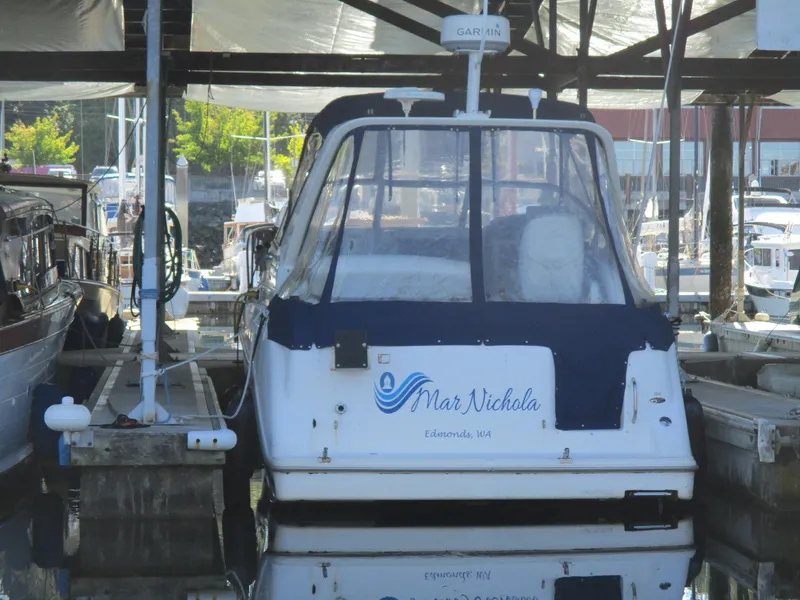 Slide: The Image of 1998 Bayliner 2855 Ciera Sunbridge docked at marina, rear view. - 33