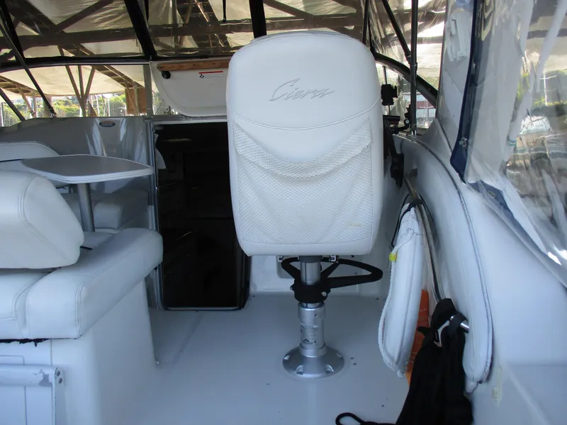 Slide: The Image of 1998 Bayliner 2855 Ciera Sunbridge interior with white seating and table. - 6