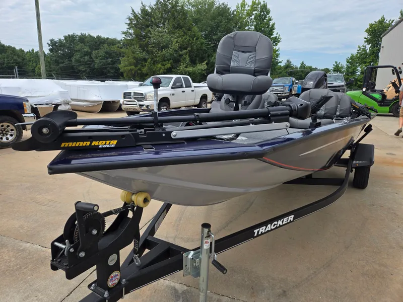 Slide: The Image of 2019 Tracker Pro Team 175 TF boat with Minn Kota motor on trailer. - 2