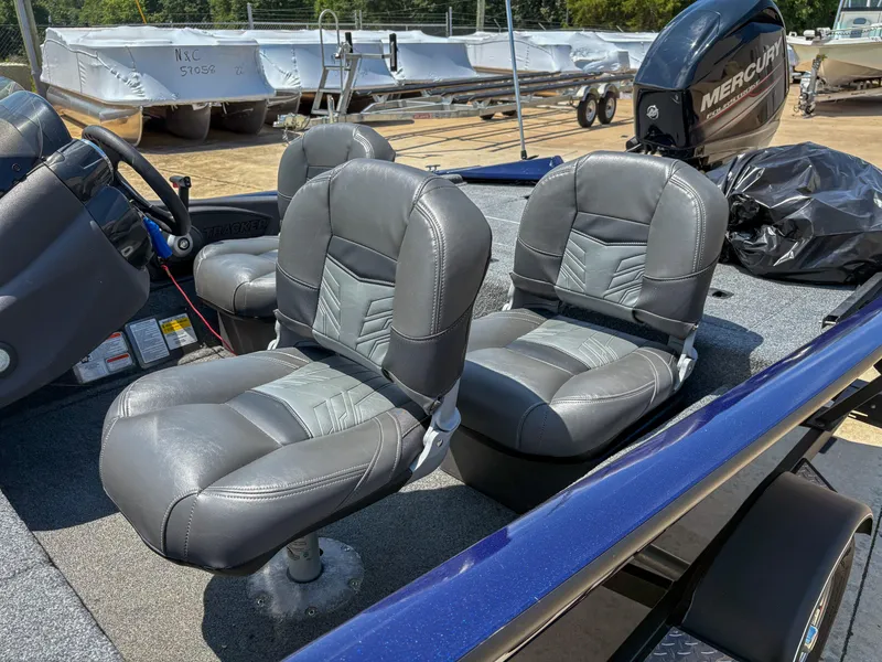 Slide: The Image of 2019 Tracker Pro Team 175 TF boat interior with gray seats and Mercury engine. - 7