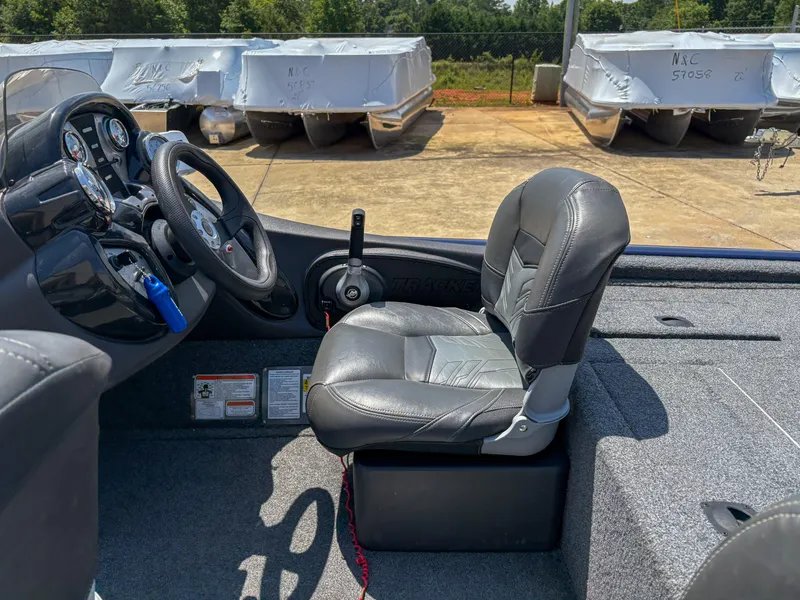 Slide: The Image of 2019 Tracker Pro Team 175 TF boat interior with steering wheel and seat. - 8