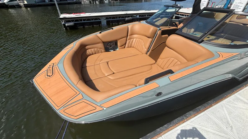 Slide: The Image of Luxury MB B52 25 Alpha boat, 2025 model, with tan leather seating, docked on water. - 10