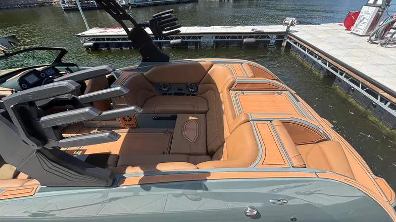 Slide: The Image of Luxurious interior of 2025 MB B52 25 Alpha boat with tan leather seating. - 11