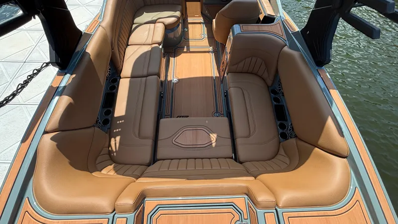 Slide: The Image of Luxurious interior of 2025 MB B52 25 Alpha boat with tan leather seating. - 13