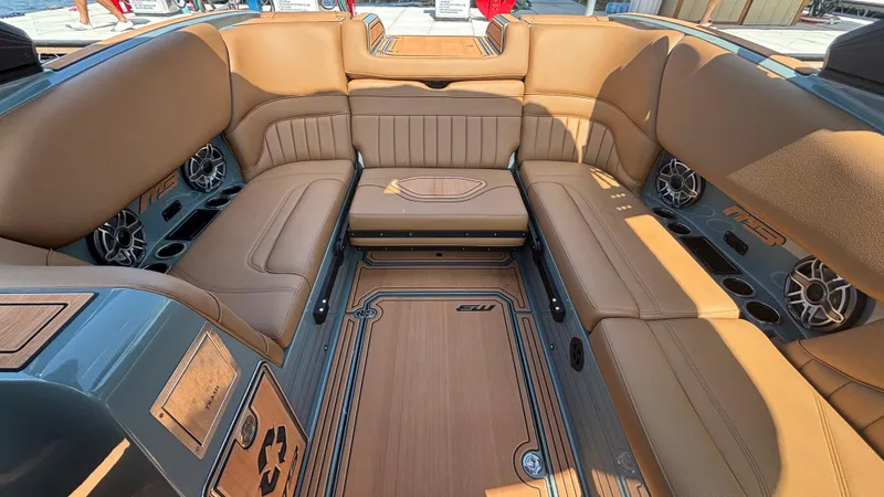 Slide: The Image of Luxurious interior of 2025 MB B52 25 Alpha boat with tan leather seating and speakers. - 15
