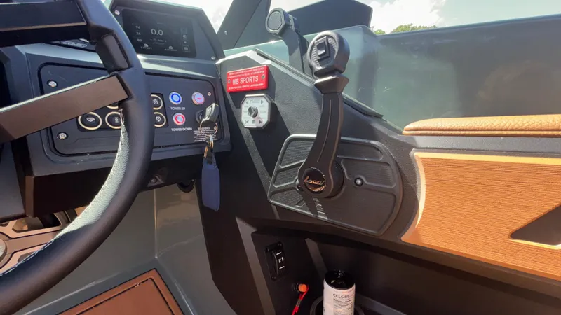 Slide: The Image of Interior dashboard of 2025 MB B52 25 Alpha boat with steering wheel and controls. - 32