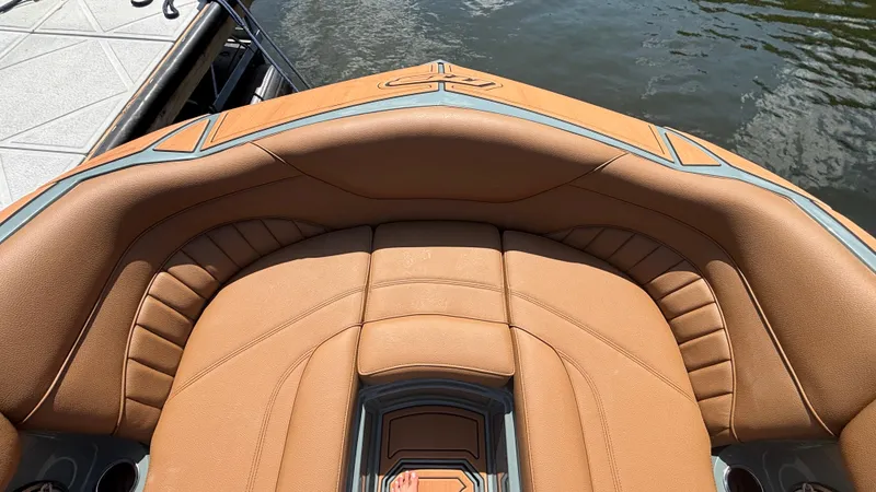 Slide: The Image of Luxurious seating on 2025 MB B52 25 Alpha boat, docked by the water. - 39