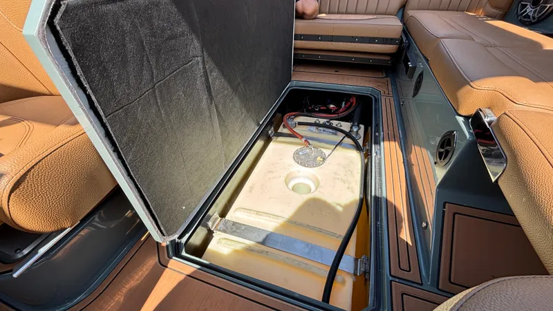 Slide: The Image of Open storage compartment in 2025 MB B52 25 Alpha boat, revealing internal components. - 44