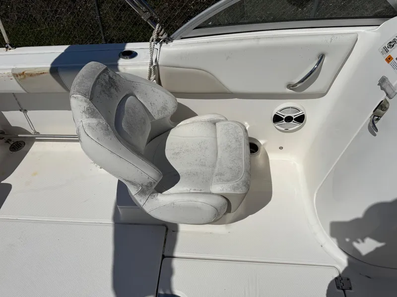 Slide: The Image of 2014 Robalo R207 Dual Console boat seat with speaker and cup holder. - 12