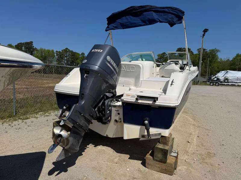 Slide: The Image of 2014 Robalo R207 Dual Console boat with Yamaha 150 outboard motor, parked on blocks. - 6
