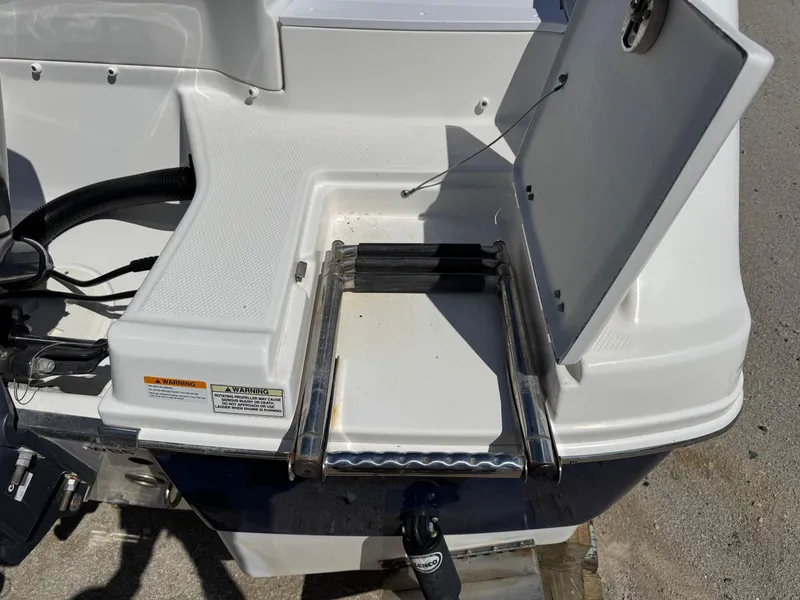 Slide: The Image of 2014 Robalo R207 Dual Console swim platform with foldable ladder and open hatch. - 7