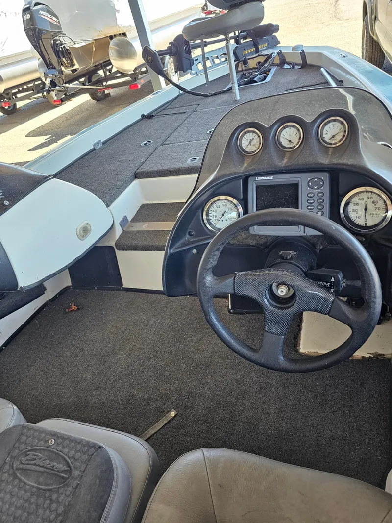 Slide: The Image of 2005 Blazer 202 Pro-V boat interior with steering wheel and dashboard gauges. - 6