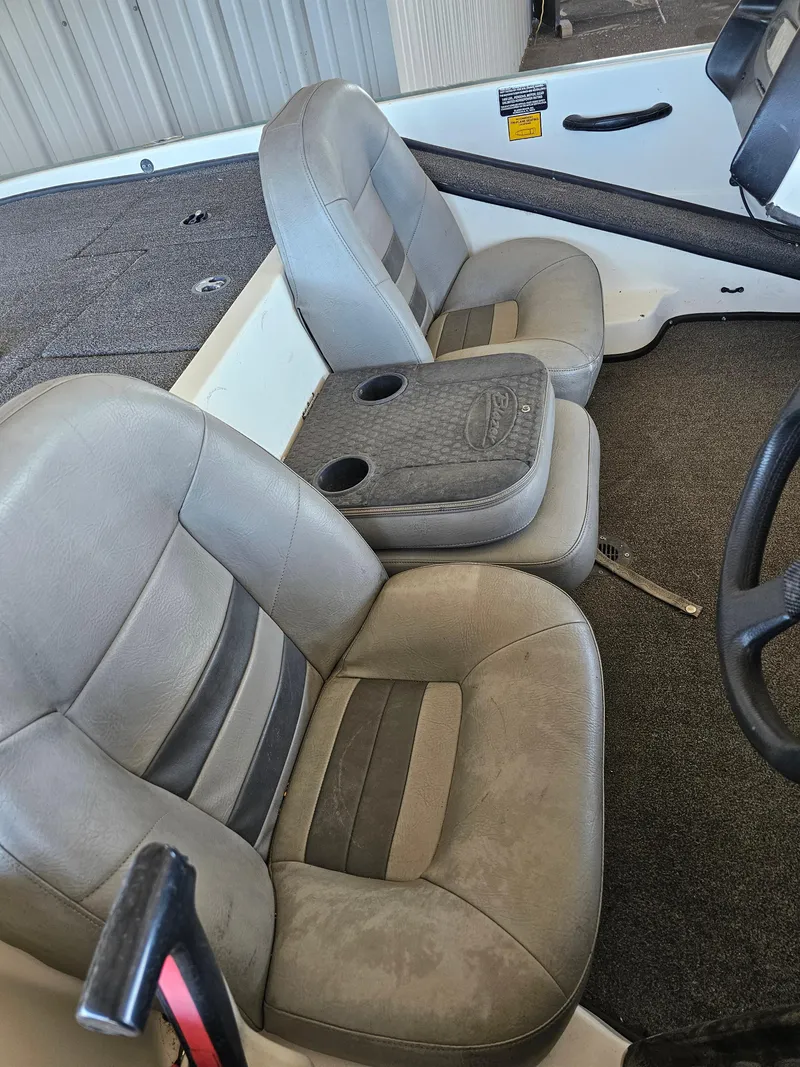 Slide: The Image of 2005 Blazer 202 Pro-V boat interior with dual seats and cup holders. - 8