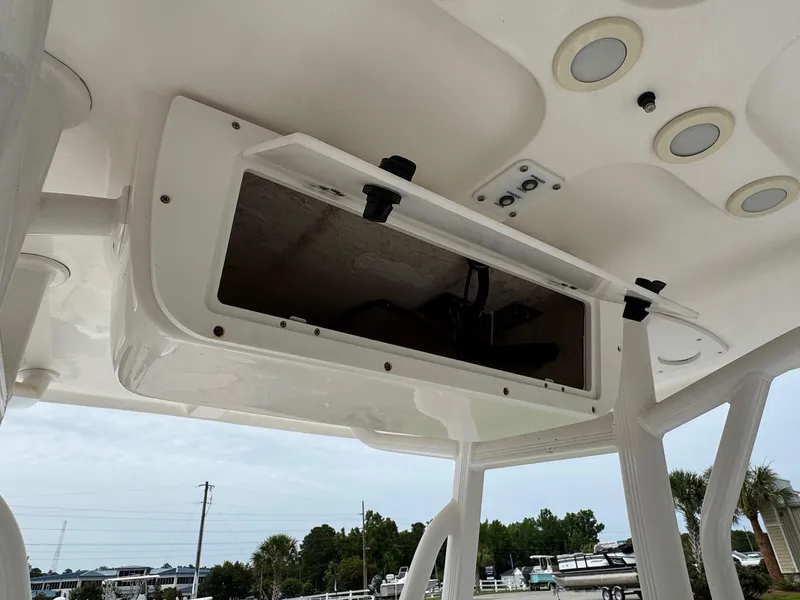 Slide: The Image of 2016 Sea Hunt BX22 boat with open overhead storage compartment and recessed lighting. - 12