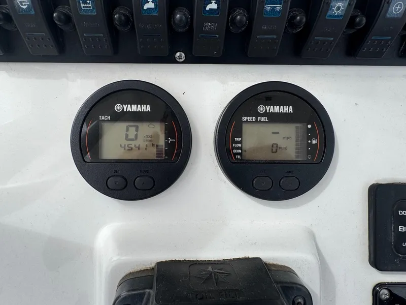 Slide: The Image of Yamaha gauges on 2016 Sea Hunt BX22 boat dashboard, displaying tachometer and speed fuel metrics. - 15