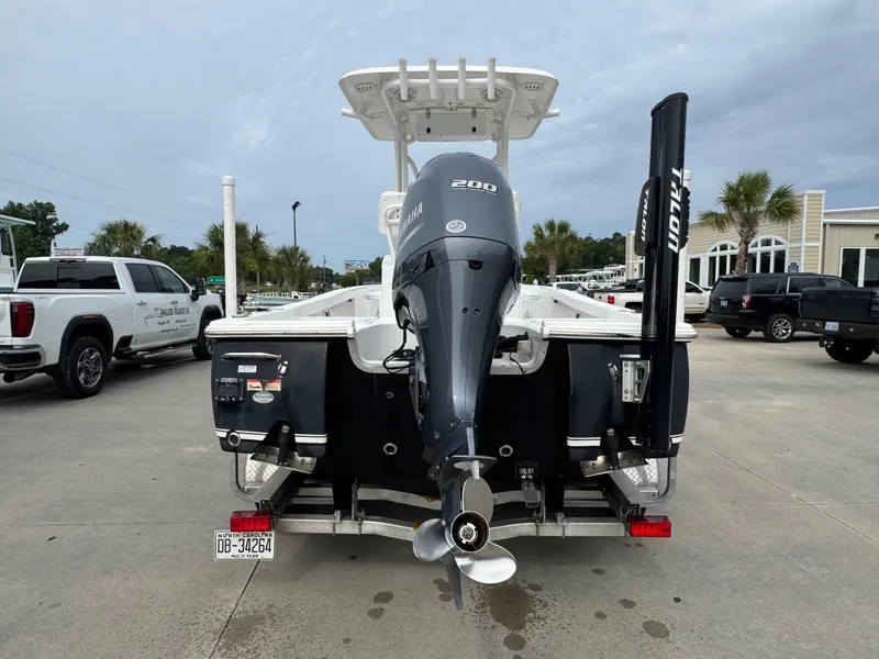 Slide: The Image of 2016 Sea Hunt BX22 boat with Yamaha 200 engine, parked outdoors. - 4