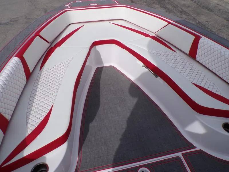 Slide: The Image of 2026 Statement 250 Center Console boat interior with red and white cushioned seating. - 10