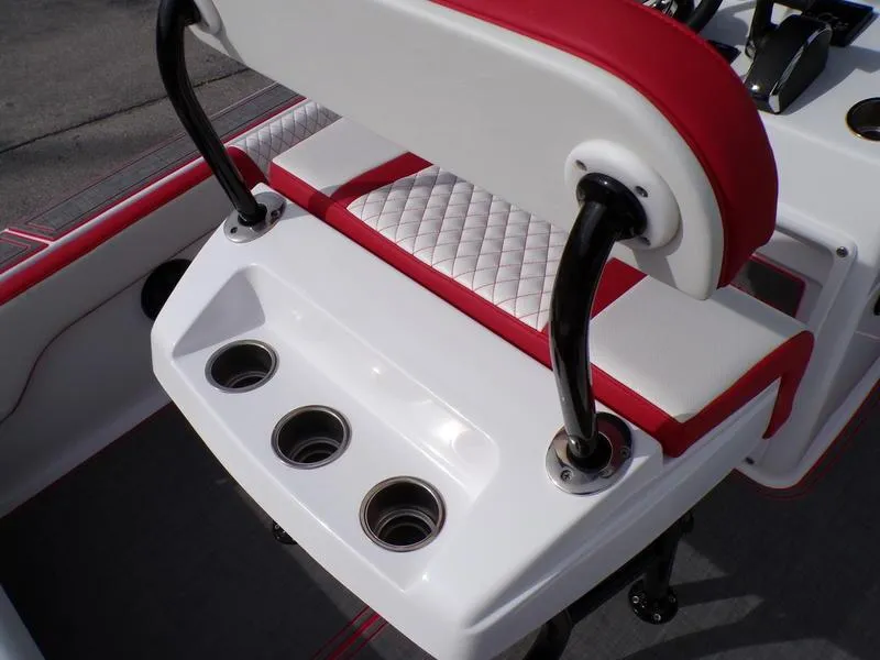 Slide: The Image of 2026 Statement 250 Center Console boat seat with red and white upholstery and cup holders. - 11