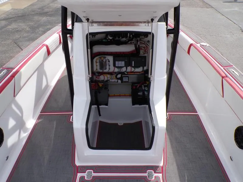 Slide: The Image of 2026 Statement 250 Center Console boat interior with open console showing wiring and controls. - 17