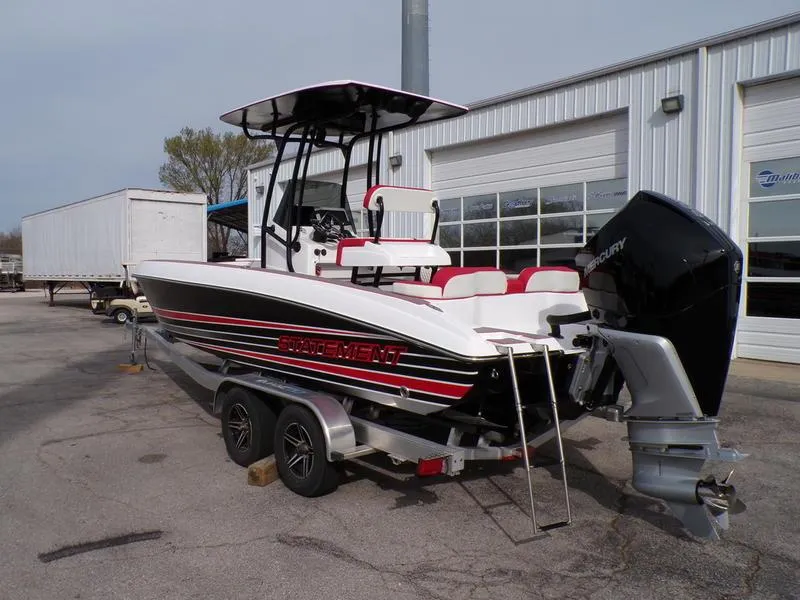 Slide: The Image of 2026 Statement 250 Center Console boat on trailer, parked outside a garage. - 19
