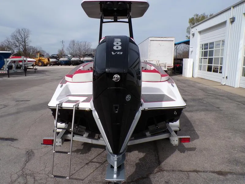 Slide: The Image of 2026 Statement 250 Center Console boat with powerful 300 V8 engine, parked outdoors. - 4