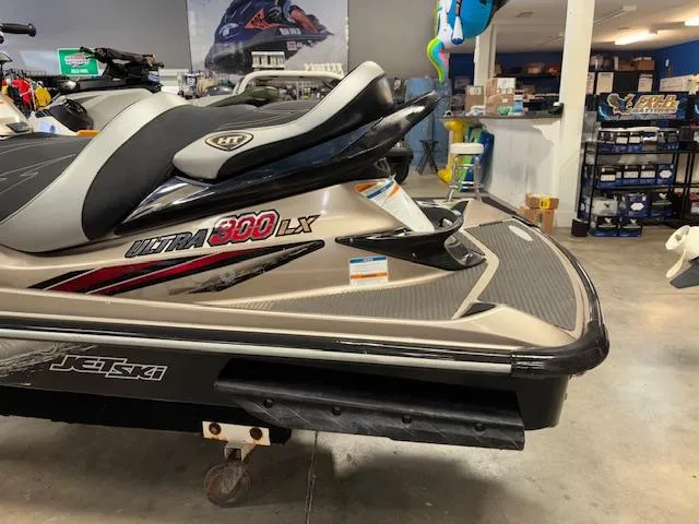 Slide: The Image of 2013 Kawasaki Ultra 300 LX jet ski in showroom, side view. - 11