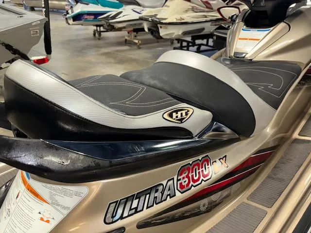 Slide: The Image of 2013 Kawasaki Ultra 300 LX jet ski with sleek design and comfortable seating. - 15