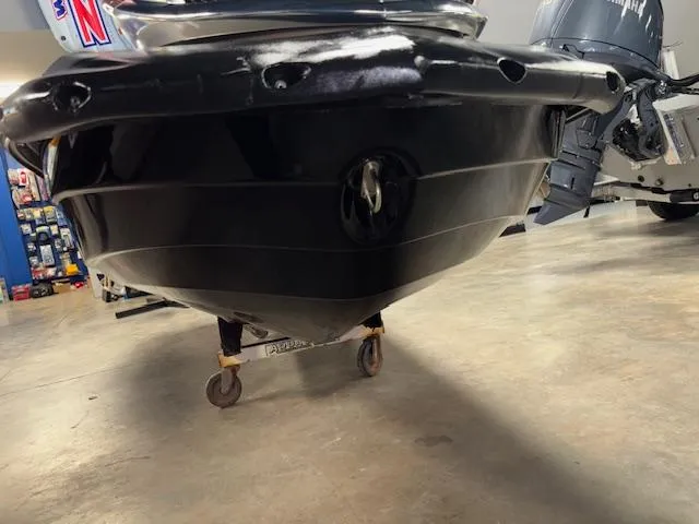 Slide: The Image of 2013 Kawasaki Ultra 300 LX jet ski hull on display in a showroom. - 18