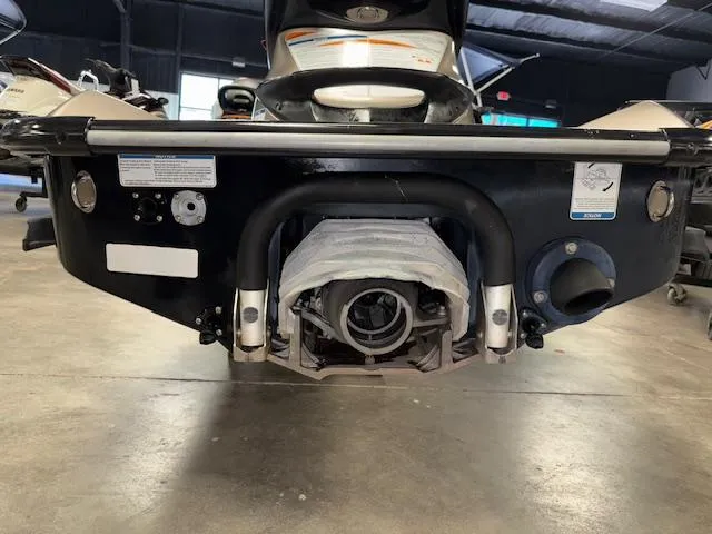 Slide: The Image of 2013 Kawasaki Ultra 300 LX jet ski rear view in a garage setting. - 19