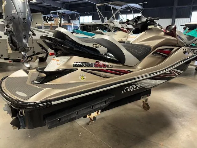 Slide: The Image of 2013 Kawasaki Ultra 300 LX jet ski in showroom, side view. - 6