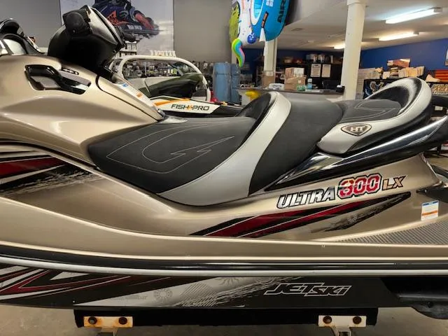 Slide: The Image of 2013 Kawasaki Ultra 300 LX jet ski in showroom, side view. - 9