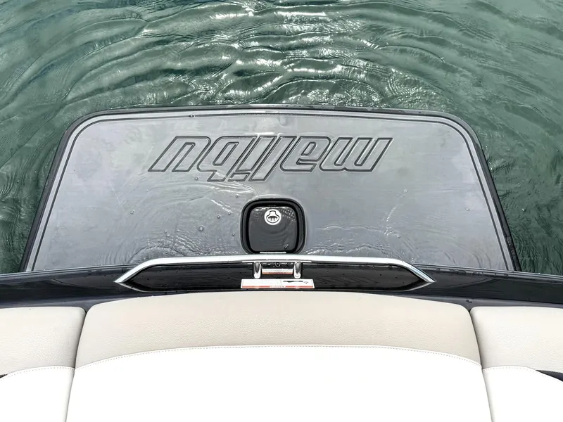 Slide: The Image of Rear view of a 2012 Malibu 21 Ride boat on water. - 14