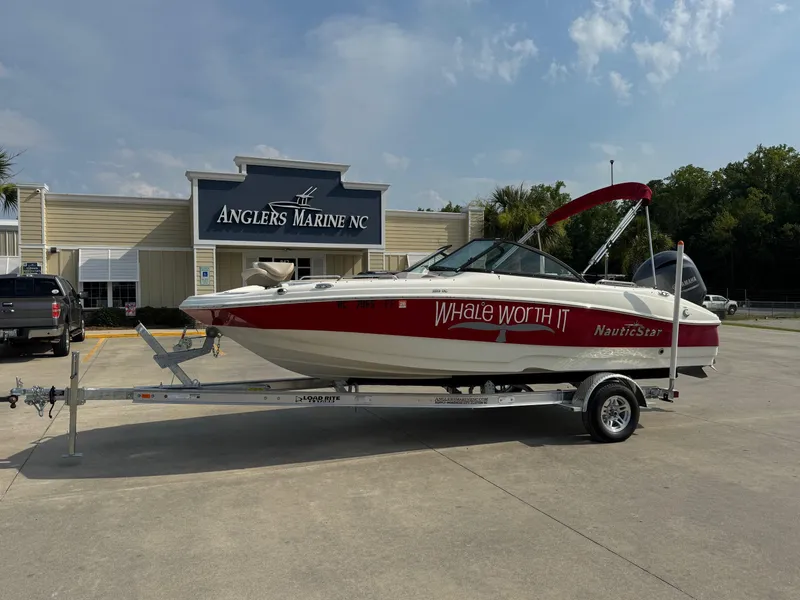Slide: The Image of 2017 NauticStar 203 DC boat on trailer at Anglers Marine NC dealership. - 1