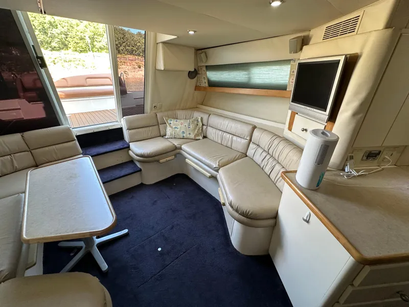 Slide: The Image of Interior of 1996 Carver 38 Santego yacht with beige seating and modern amenities. - 41