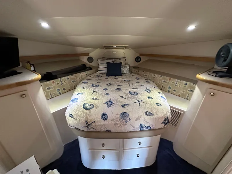 Slide: The Image of Cozy cabin interior of 1996 Carver 38 Santego with nautical-themed bedding. - 44