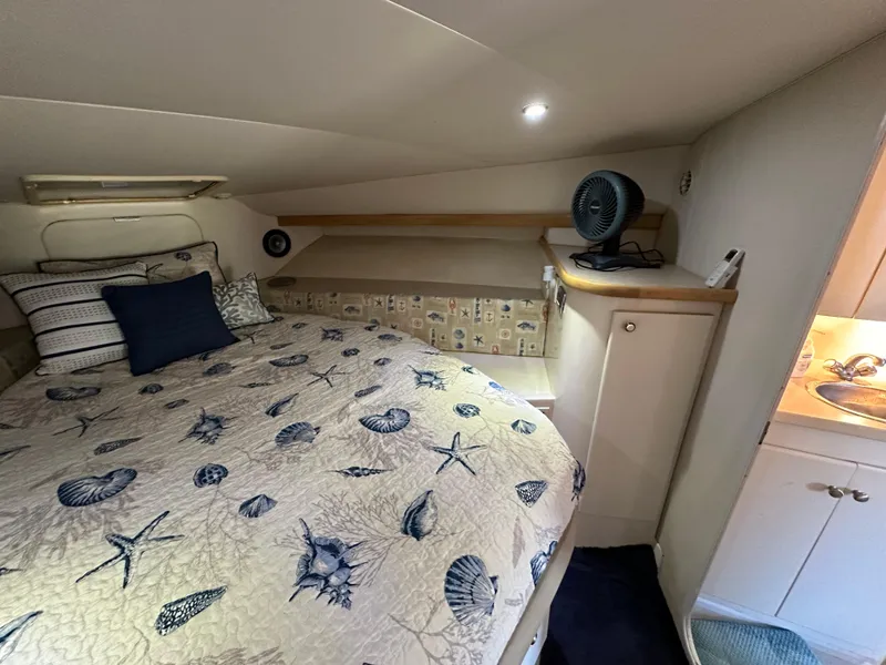Slide: The Image of Cozy bedroom in 1996 Carver 38 Santego yacht with nautical-themed bedding. - 45