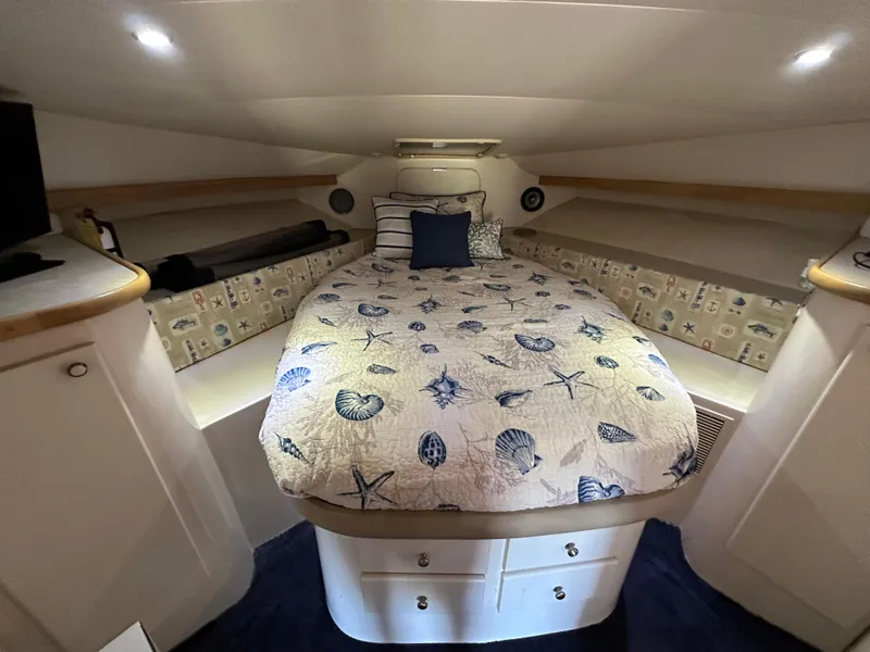 Slide: The Image of Cozy cabin interior of 1996 Carver 38 Santego with nautical-themed bedding. - 47