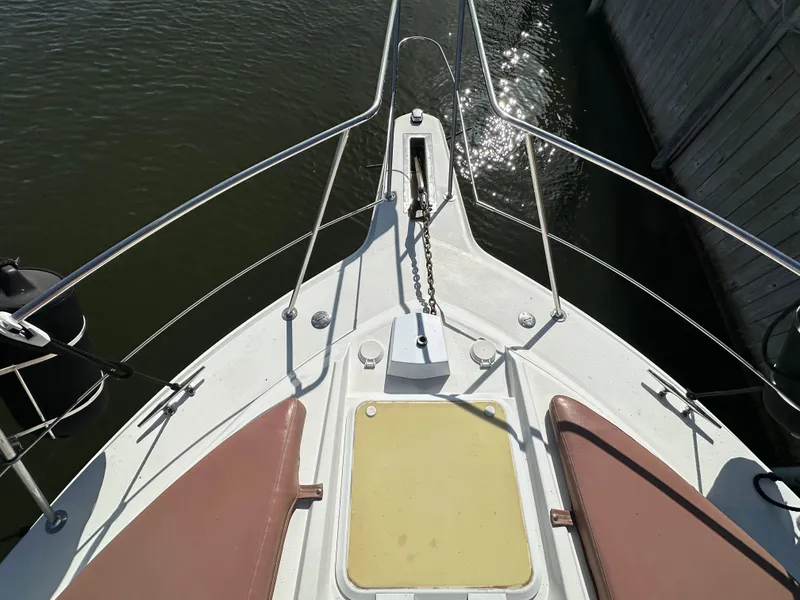 Slide: The Image of Bow view of 1996 Carver 38 Santego yacht with anchor chain and seating. - 20
