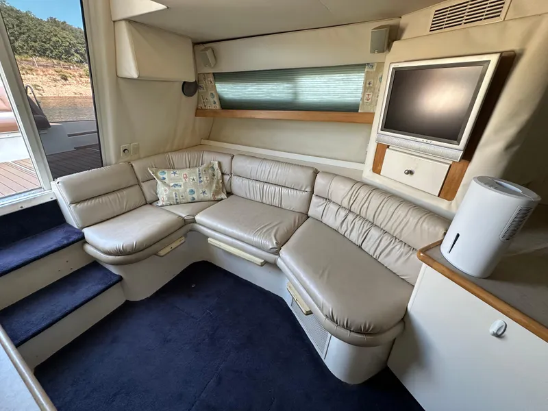 Slide: The Image of Interior of 1996 Carver 38 Santego yacht with leather seating and TV. - 35