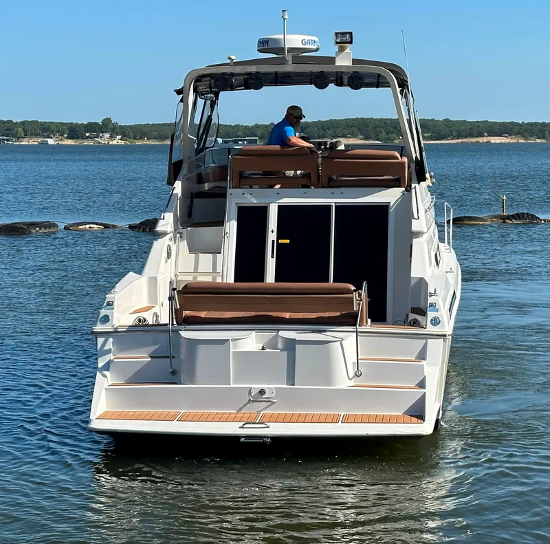 Slide: The Image of 1996 Carver 38 Santego yacht on calm water, rear view. - 6