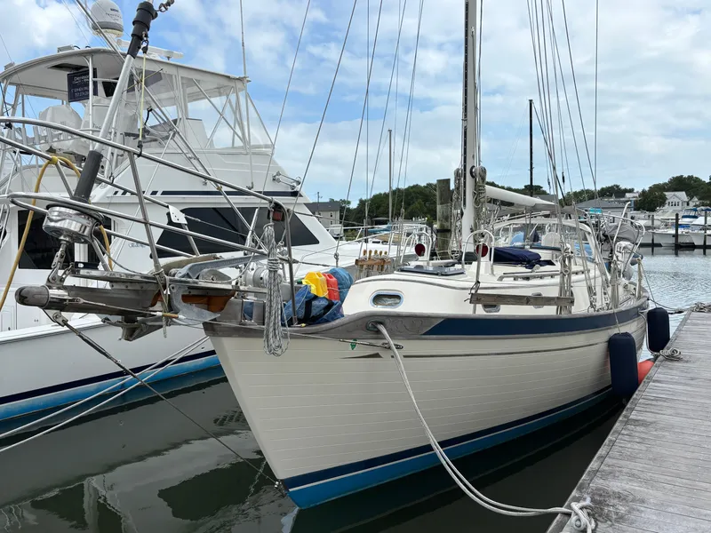 The Image of 1987 Ta Shing Tashiba 36 sailboat docked at marina, clear sky background. - 0