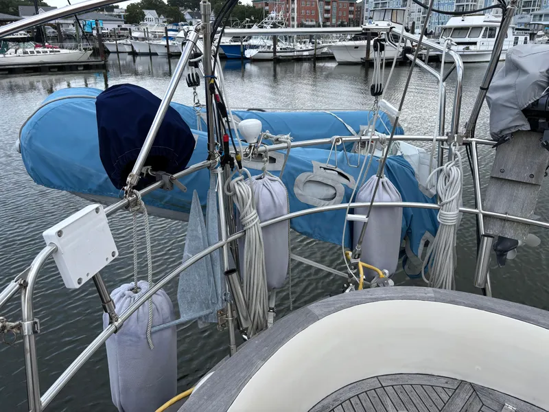 Slide: The Image of 1987 Ta Shing Tashiba 36 sailboat with dinghy and marina background. - 16