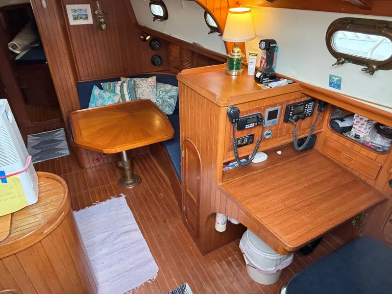 Slide: The Image of Cozy 1987 Ta Shing Tashiba 36 yacht interior with wooden furnishings and navigation equipment. - 19