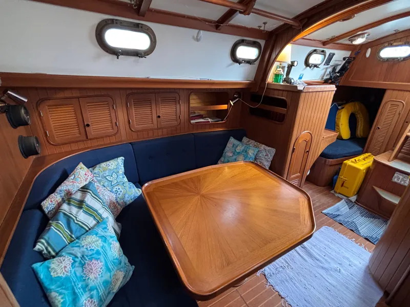 Slide: The Image of Cozy interior of 1987 Ta Shing Tashiba 36 sailboat with wooden table and cushions. - 21