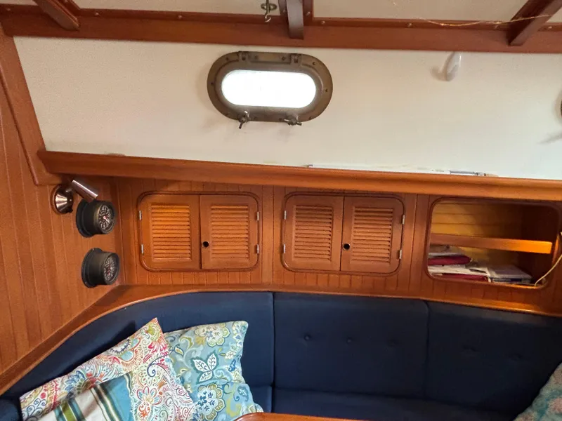 Slide: The Image of Interior of 1987 Ta Shing Tashiba 36 sailboat with wood paneling and blue cushions. - 22