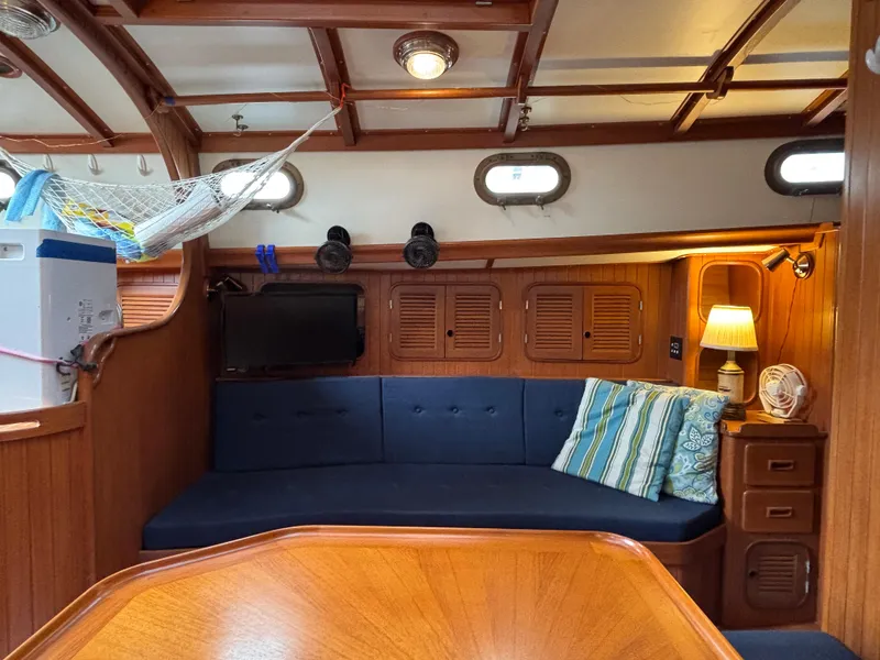 Slide: The Image of 1987 Ta Shing Tashiba 36 yacht interior with cozy seating, wooden cabinetry, and ambient lighting. - 23