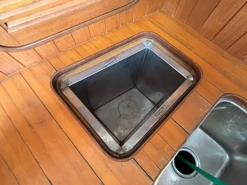 Slide: The Image of Wooden interior of 1987 Ta Shing Tashiba 36 yacht with open storage compartment. - 37