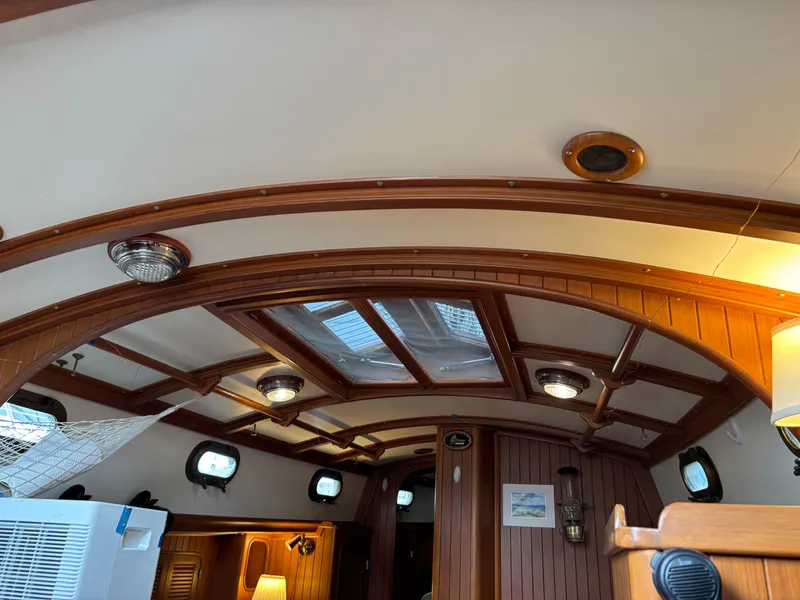 Slide: The Image of Interior of 1987 Ta Shing Tashiba 36 sailboat with wooden beams and skylight. - 38