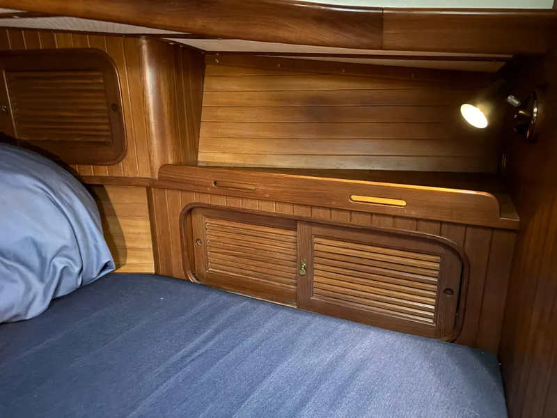 Slide: The Image of Cozy cabin interior of 1987 Ta Shing Tashiba 36 sailboat with wooden paneling and bedding. - 41