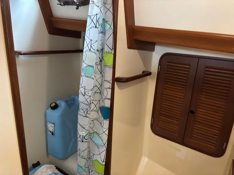 Slide: The Image of Interior of 1987 Ta Shing Tashiba 36 sailboat with storage area and nautical decor. - 42